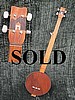 Full Length Fretless with one piece mahogany drumhead REMO hoop and headstock inlay